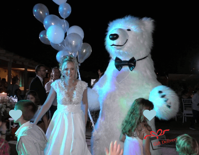 The White Polar Bear came to the wedding to deliver the gift to the bride and groom. Gift Delivery. Wedding gift. Surprise from the Political bear. White Polar Bear at the wedding.